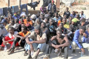 8migranti-in-un-centro-di-detenzione-in-libia